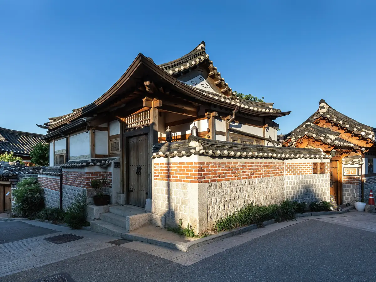Traditional hanok houses with curved tiled roofs in Bukchon Hanok Village, Seoul